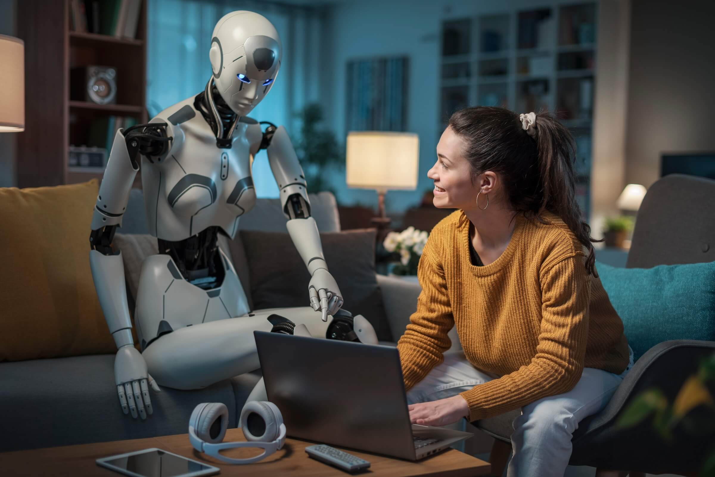 Ładna młoda dziewczyna uczy się za pomocą swojego androida wyposażonego w sztuczną inteligencję. Koncepcja przydatności A.I. w codziennym życiu ludzi.